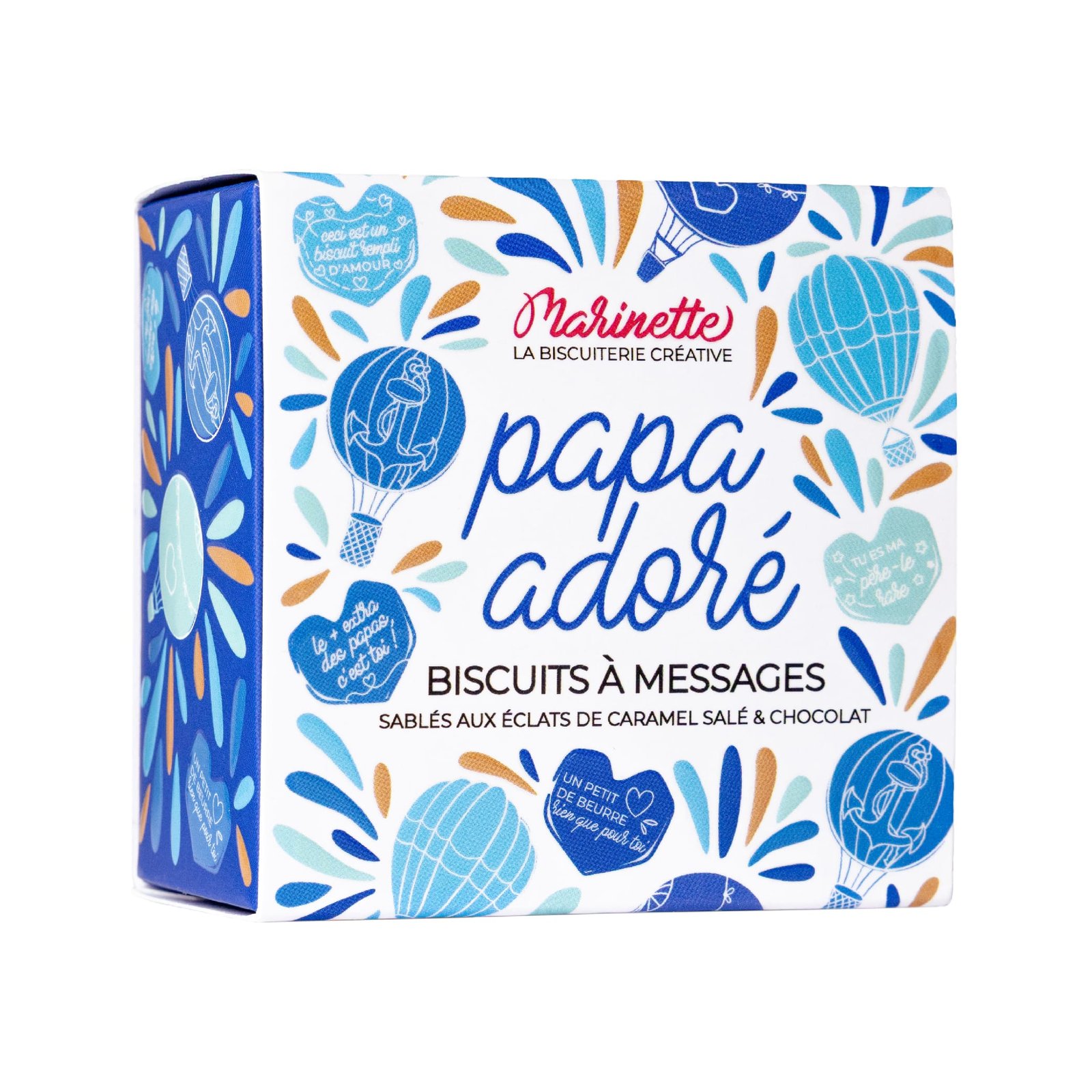 Une boîte à biscuits colorée « papa adoré », comprenant un biscuit personnalisé, décoré de cœurs bleus et dorés, de montgolfières et de notes manuscrites en français - des motifs ludiques parfaits pour papa et maman.